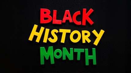 Black History Month block text in red, green, and yellow