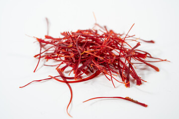 Fototapeta premium Dried bright red saffron isolated on white background.