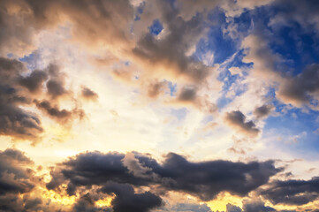 Fototapeta premium cloudy sky with clouds at sunset. Background of the orange blue sky at sunrise