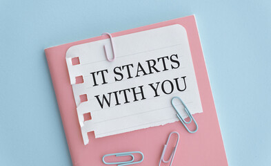 IT STARTS WITH YOU text written on white background with keyboard.