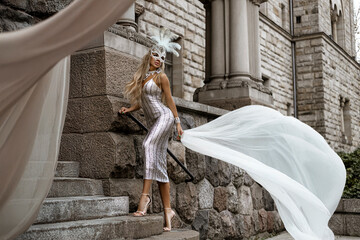 Elegant luxury evening fashion. Glamour, stylish elegant woman in silver sequin evening dress and...