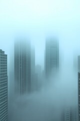 Fototapeta premium skyscrapers in an early morning setting, mist gently rising around each structure