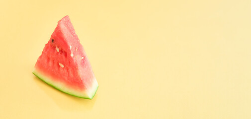 Fresh sliced watermelon isolated on yellow background. Ripe red watermelon. Minimal creative concept. Place for text. Bright healthy summer food.