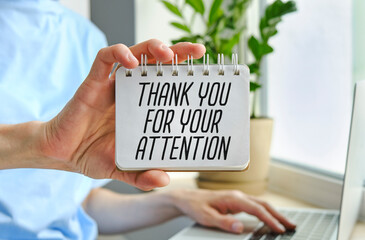 Hands hold a card with the text Creative concept Thank You For Your Attention