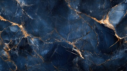 A close-up of a dark blue marble surface with golden veins, ideal for backgrounds or textures.