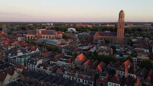 Zwolle, the Netherlands: June 19th 2024: Drone flying over the city center towards the Peperbus tower.