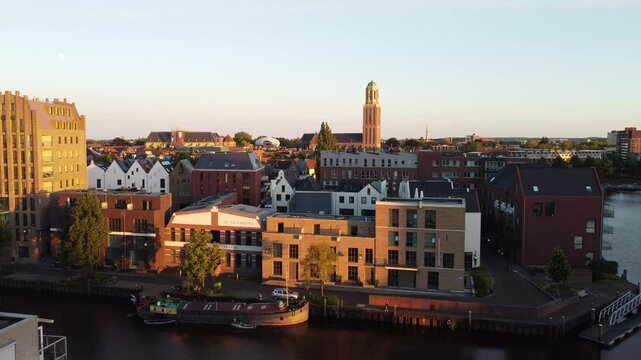 Zwolle, the Netherlands - June 19th 2024: Drone flying towards the Peperbus over the new built Kraanbolwerk residential area. 