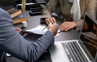 Salesmen are letting the male customers sign the sales contract, Asian women and men are doing...