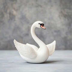 Naklejka premium Plaster figurine of a swan, emphasizing grace and movement