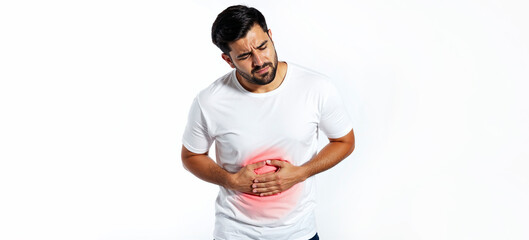 Naklejka premium Man holding her stomach showing pain on a white background. Pain in the abdomen, stomach