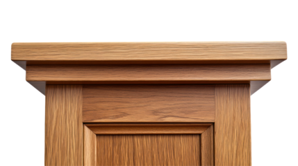 A close-up view of a wooden door frame with a decorative top edge, showcasing craftsmanship and design.