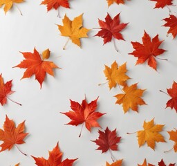 Obraz premium Red and orange maple leaves scattered on white surface, white background, autumn decor, nature photography
