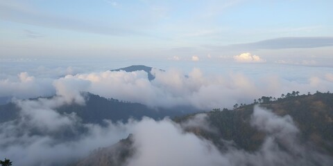 Fototapeta premium Soft grey clouds covering Kodaikanal Hills with serene atmosphere , hills, clouds, serene