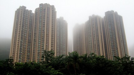 Fototapeta premium Towering Skyscrapers Shrouded in Mist and Fog