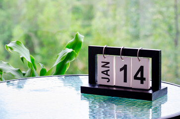 14 January calendar table with blurred nature background. With customizable space for text or ideas