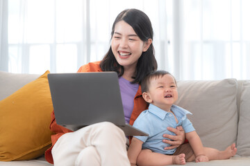 Fototapeta premium Mother and son play together after dad comes home from work
