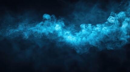 Obraz premium Mystical Blue Smoke on Dark Background Creating Ethereal Atmosphere for Creative Projects and Abstract Art