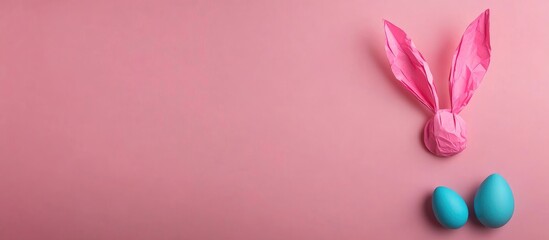 Fototapeta premium Crafted pink bunny ears and blue egg on pink background Minimalist spring decoration with ample copy space for festive text or messages