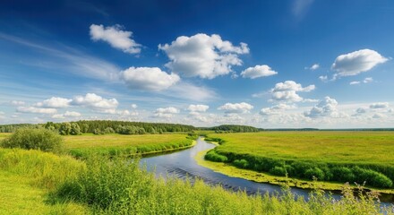 Obraz premium Tranquil river landscape with lush greenery clear blue sky
