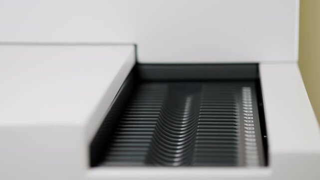 Open Microarray Scanner Tray in Modern Laboratory.