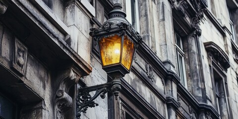 Image featuring the corner of a historic building adorned with a vintage lantern, capturing the...