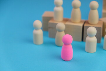 a unique color wooden toy to differentiate among others. Uniqueness concept. success, leadership and business management concept