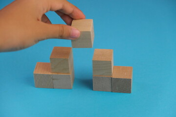 Business strategy. Growth and development. wooden cubes with people miniatures on steps with text...