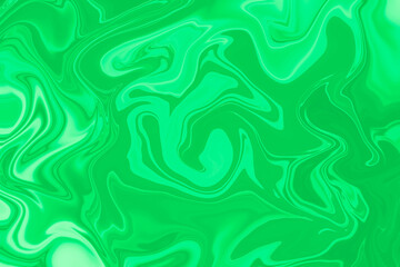 Abstract background of green color from twirling waves. Background for design. Marble ink colorful. Can be used for background or wallpaper. Good for design or logo background or backdrop.