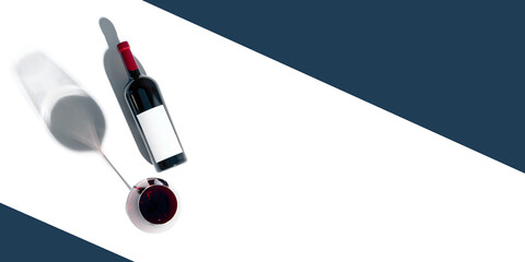 Top-down mockup of red wine bottle and glass with shadows and modern diagonal composition with deep...