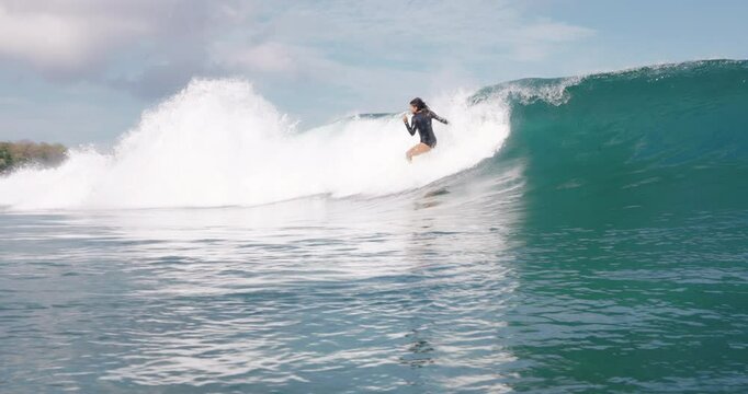 Surfer woman fell off a ocean wave. Wipe-out surf girl
