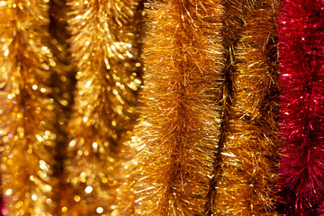 A detailed closeup view of a collection of gold and red tinsel