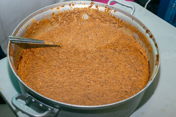 Pot full of refried beans ready to eat. Mexican food.