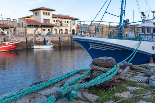 Berth in the Port of Comillas. Defocused background. Cantabria