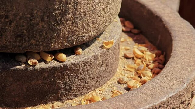 Stone grinding the yellow coffee bean to peel the silk shell. Silk Shellon.