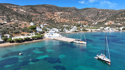Aerial drone photo of picturesque seaside fishing village of Vathy featuring landmark chapel of...