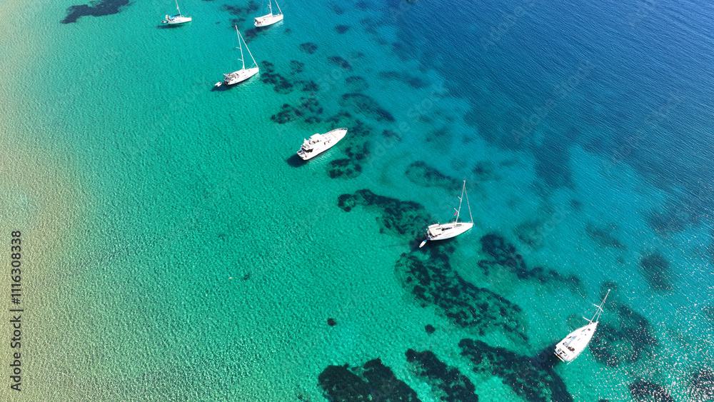 Sticker Aerial drone photo of luxury sail boat anchored in paradise bay of Ornos in island of Mykonos, Cyclades, Greece