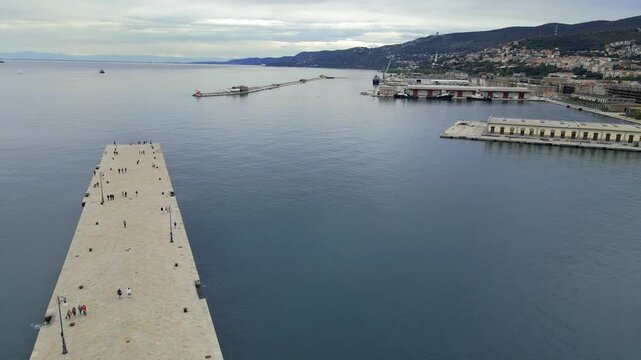 A beautiful view of the Italian city of Trieste, the drone flies like a bird above the city.