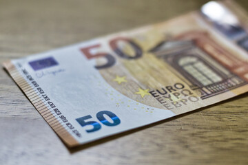 Fifty Euro Banknote on Wooden Surface