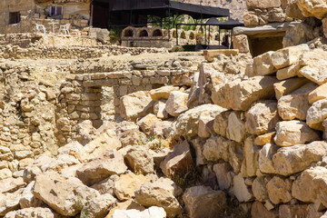 Jordan. Dana Biosphere Reserve, one of leading ecotourism reserves in Jordan. Fragment of arch with entrance to hotel in village of Dana, located onedge of large canyon. Dana, Jordan - May 19, 2011