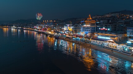Fototapeta premium Night cityscape with illuminated buildings, waterfront, and fireworks.