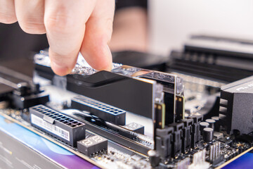 placing memory module, ram installation process, motherboard assembly, hand adjusting ram, hardware...