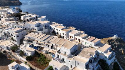 Fototapeta premium Aerial drone photo of scenic cliff-top village of Kastro or Castle built in a rock overlooking the eastern coast of the island inhabited since the prehistoric period, Sifnos island, Cyclades, Greece