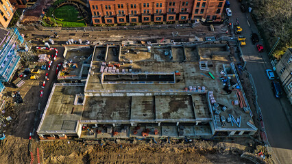 Obraz premium Aerial View of Residential Construction Site with Unfinished Concrete Structure in Kirkstall, Leeds