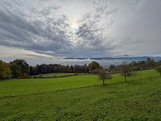 Fototapeta premium Foggy mountain panorama in autumn on a hill in Saint Gallen in Switzerland