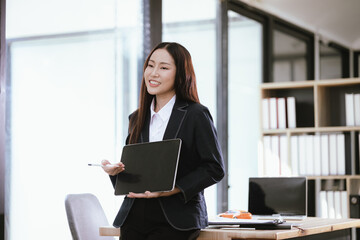 Beautiful Asian businesswoman in modern office