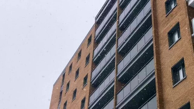Modern Brick Apartment Building in Snowfall