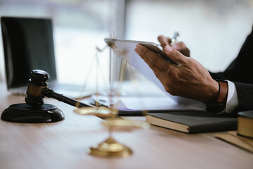 Lawyers and staff with hammers and scales are nearby to provide expert legal advice to ensure...