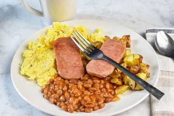 scramble eggs with fried spam and  baked  beans