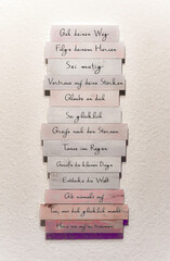 A tall stack of papers covered in intricate Arabic writing on them