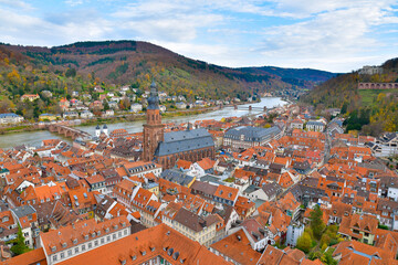 An aerial view showcases a vibrant city with a river flowing through